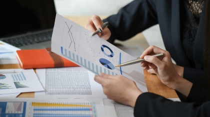 female-accountant-team-is-analyzing-data-documents-in-the-office