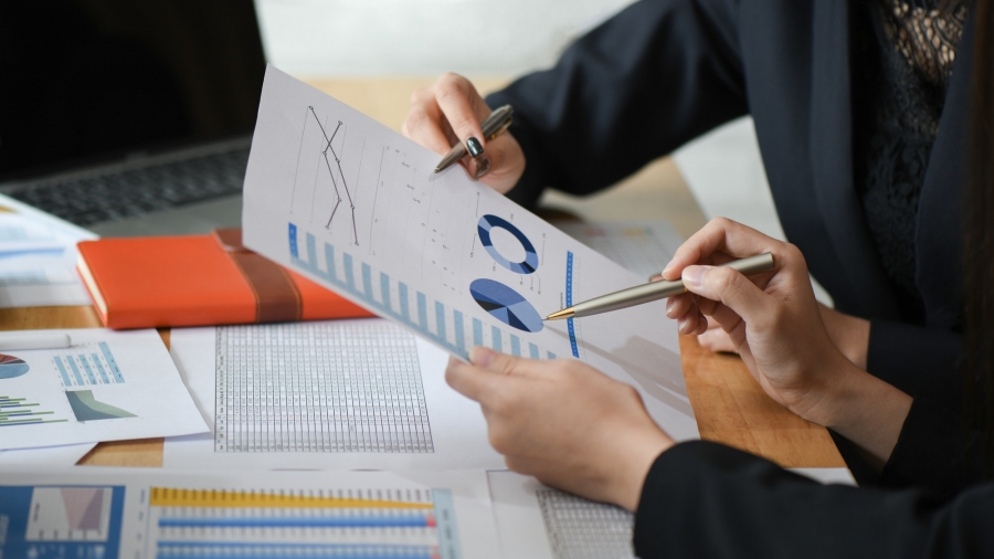 female-accountant-team-is-analyzing-data-documents-in-the-office
